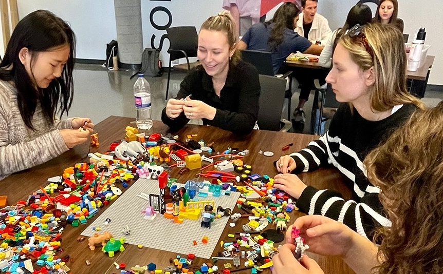 Students collaborating to build a lego set