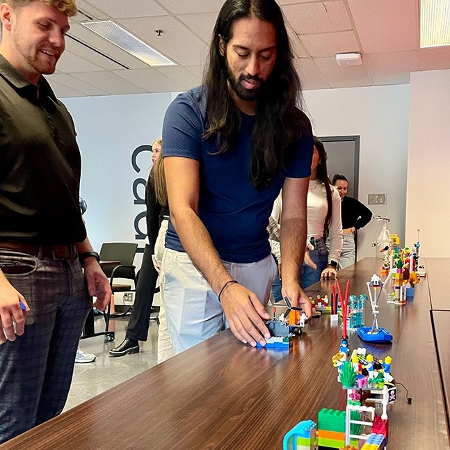 Students collaborating to build lego set