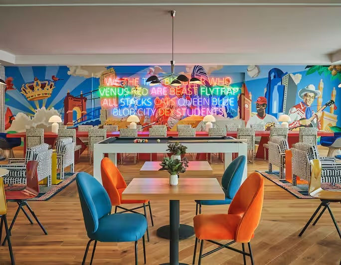 Seating area with large mural in the background 