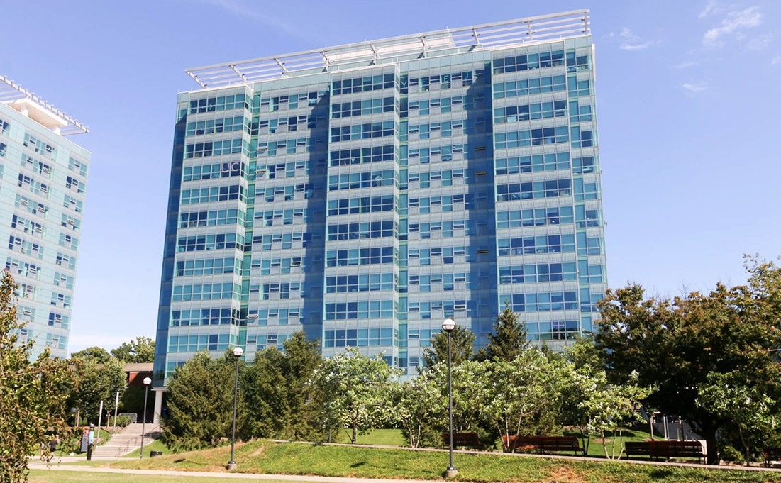 Exterior of Scioto Hall. There are trees and green space in front of the building.