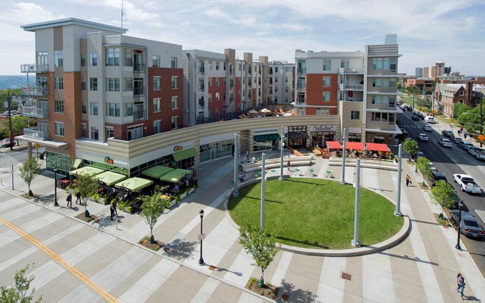 Exterior of U Square apartment building and the public courtyard that has several private business and restaurants.
