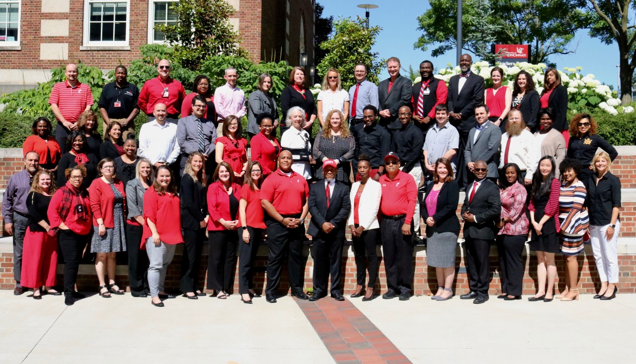 Staff senators pose in red and black