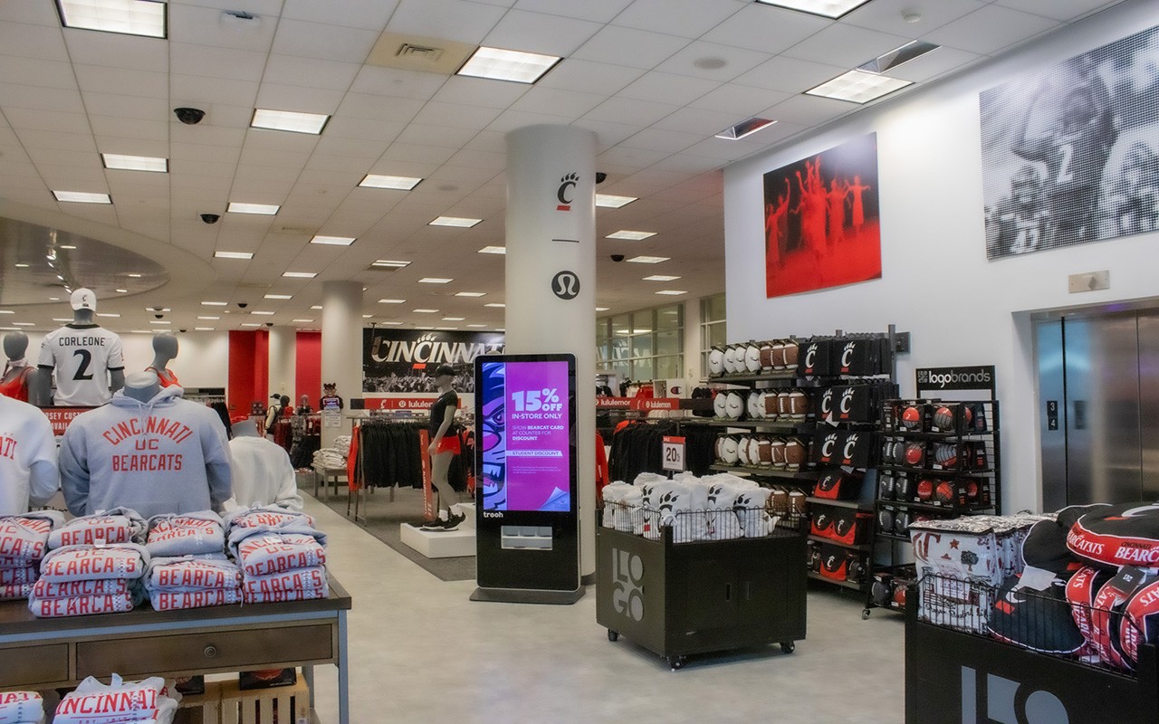 Bearcats merchandise arranged in store with football mannequin in the foreground