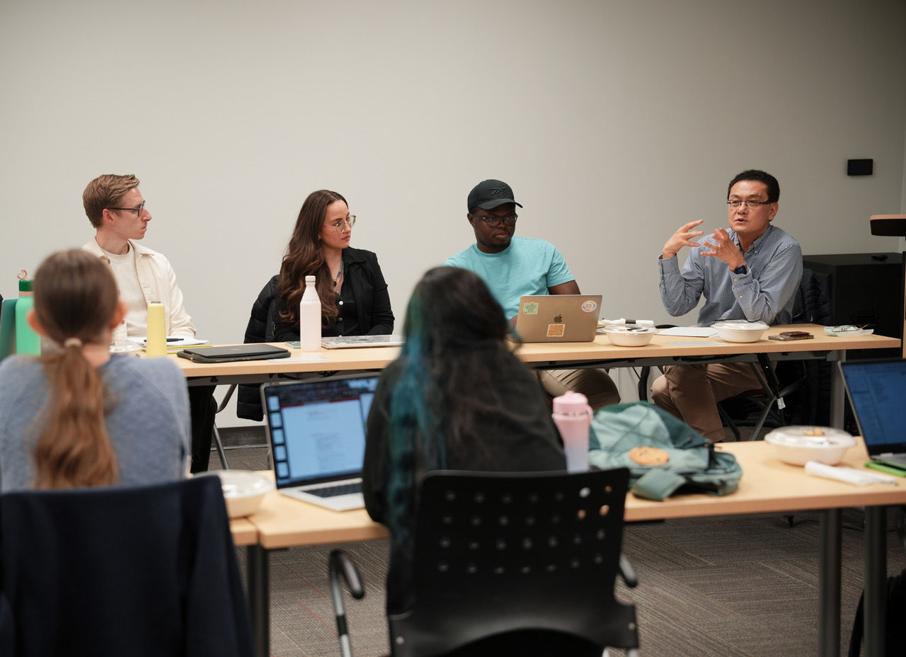 students and faculty discussing research 