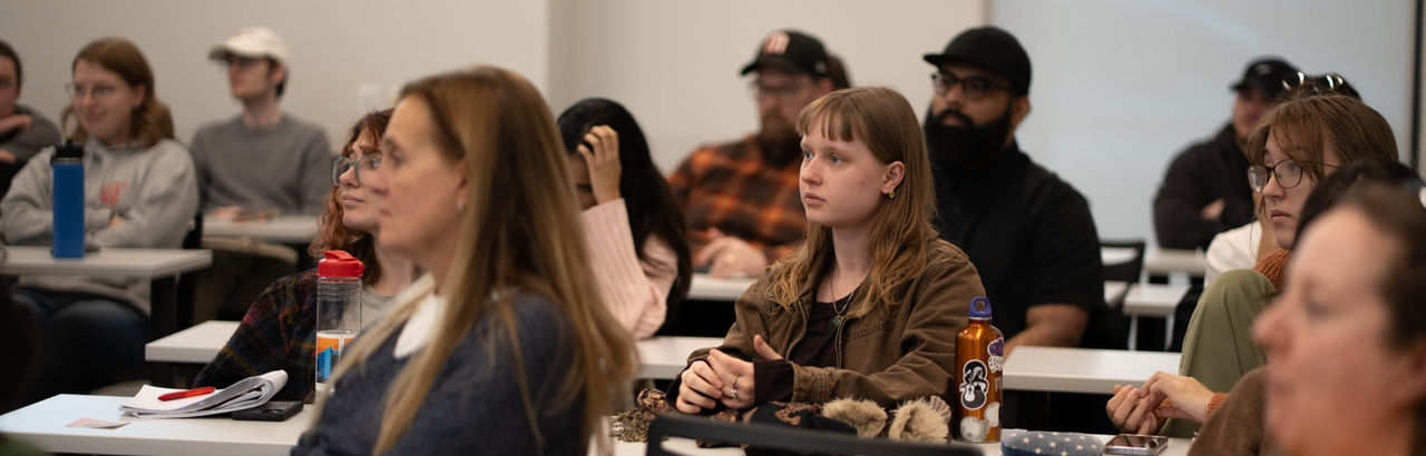 Audience listening intently at lecture