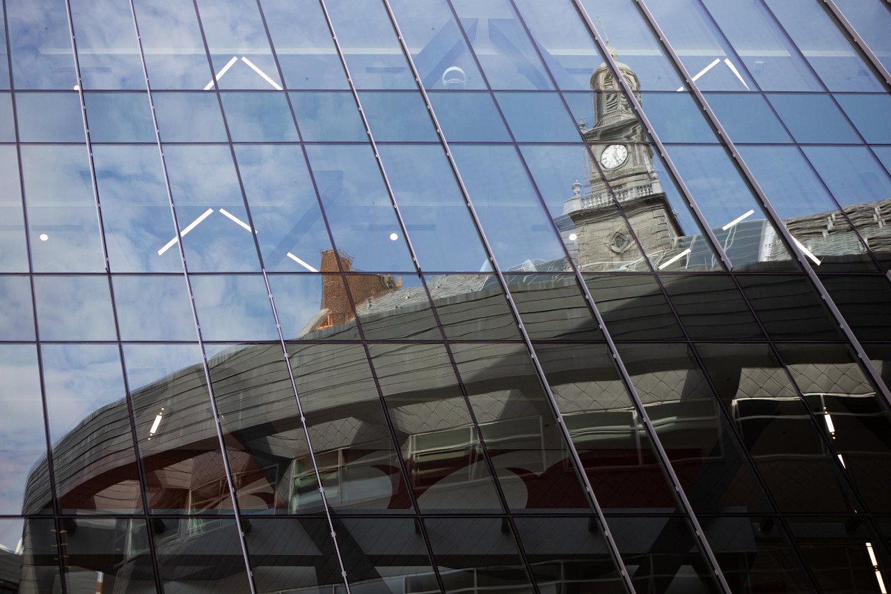 UC's Tangeman University Center reflecting in the windows of the press area of Nippert Stadium