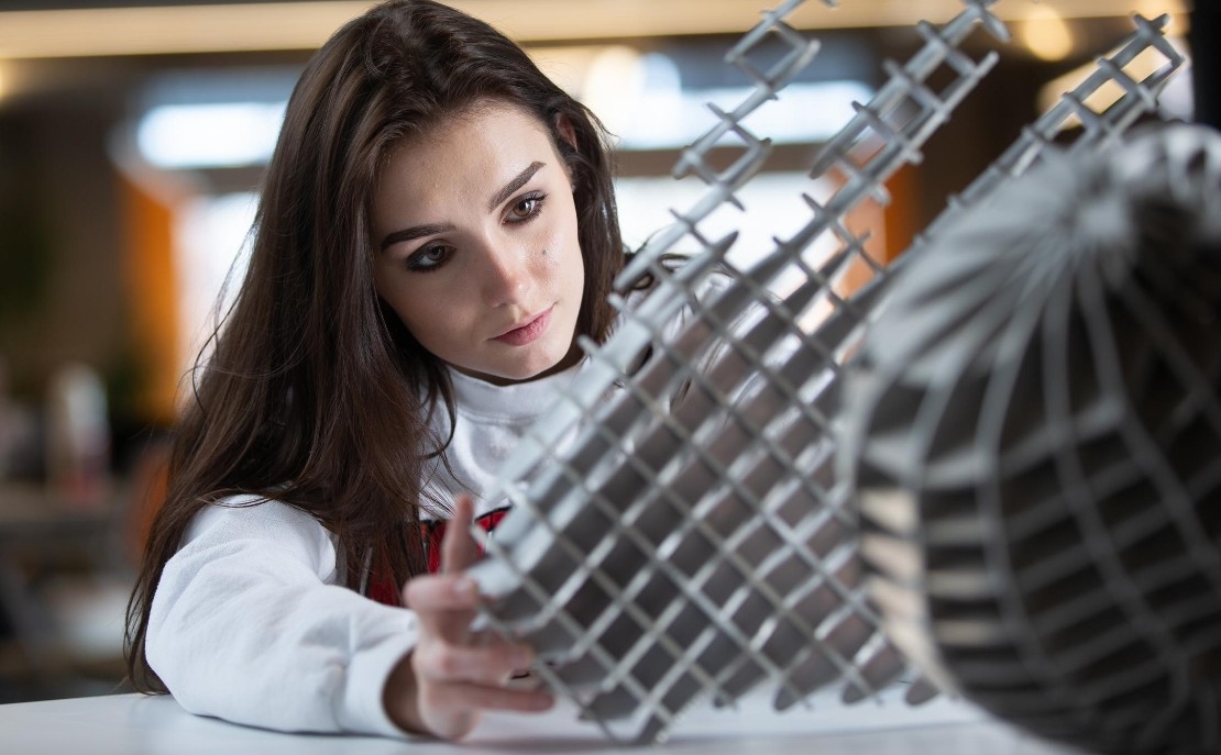 Students pose at 1819 Innovation Hub for a marketing campaign.