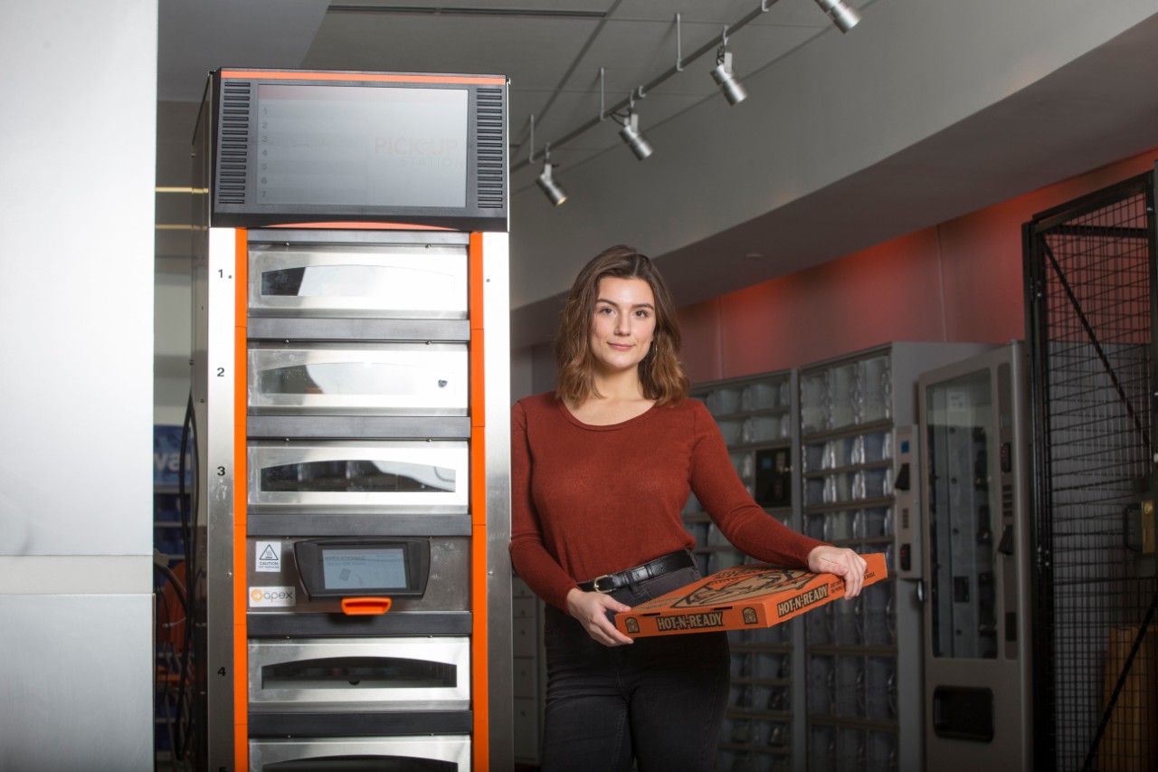 University of Cincinnati Maggie Otten shown here with Little Caesar's Pizza Portal she worked on designing during her Co-op with Apex Supply Chain Technologies. UC/Joseph Fuqua II