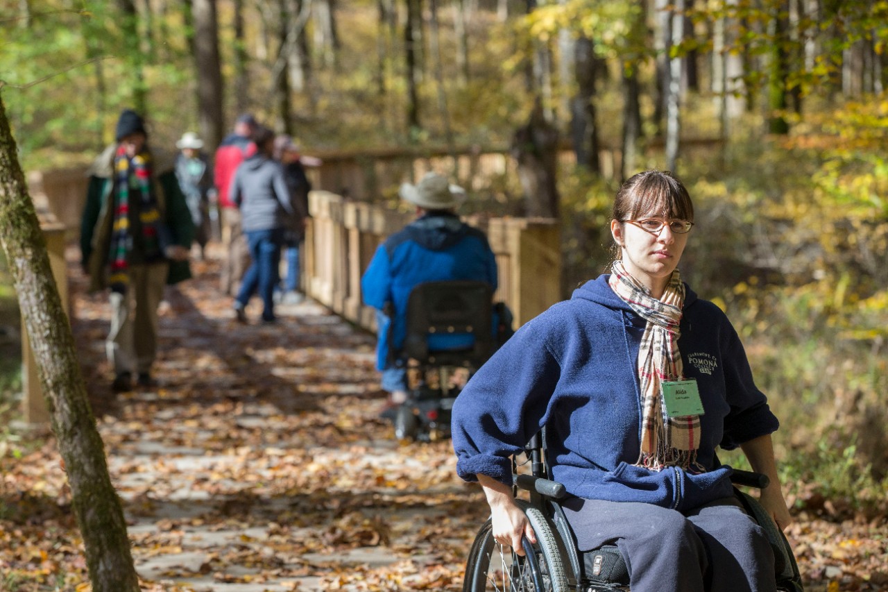 Alida Schefers explores a hiking trail from her wheelchair