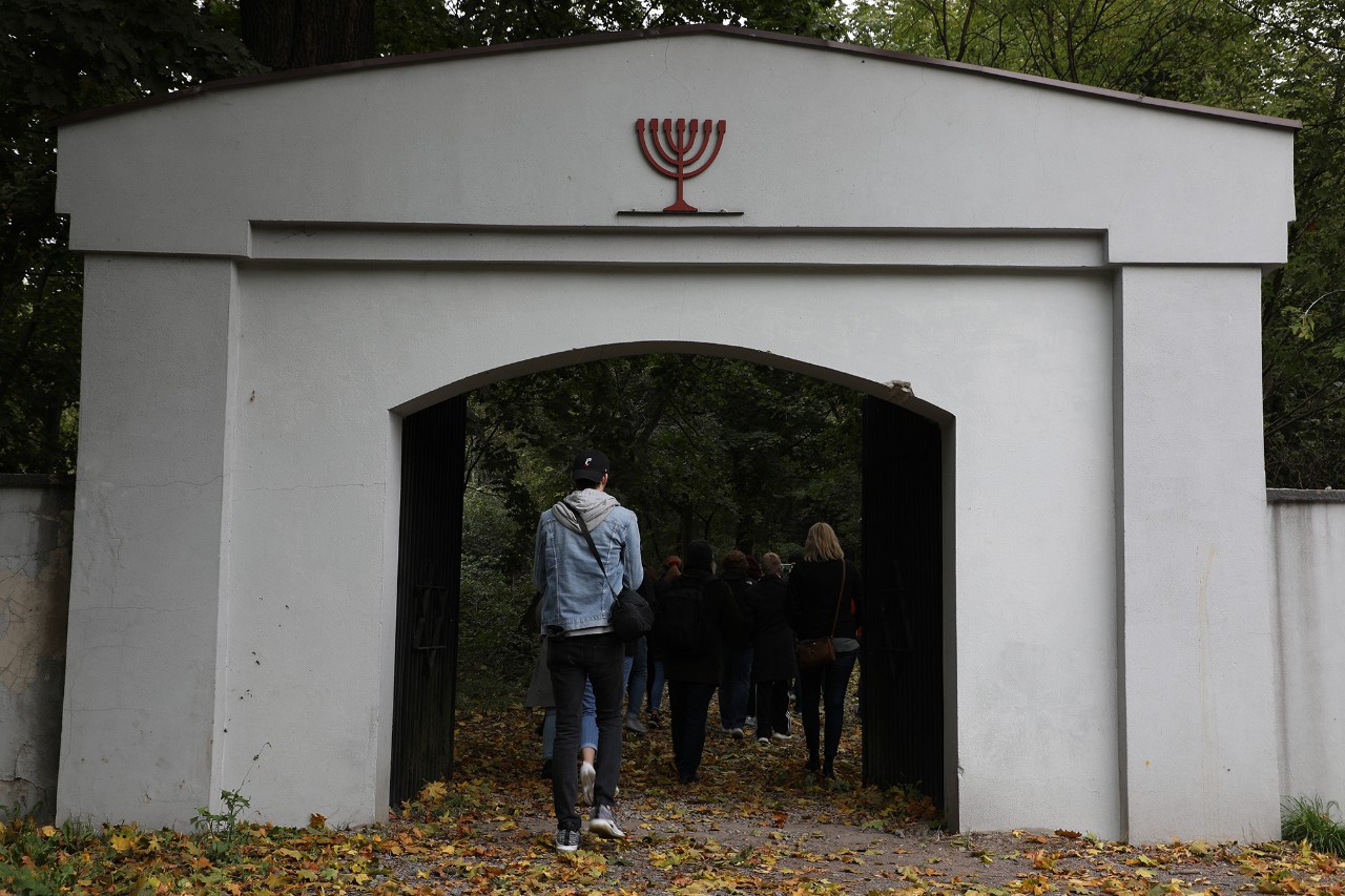 Students enter an old Jewish cemetery in Poland. 