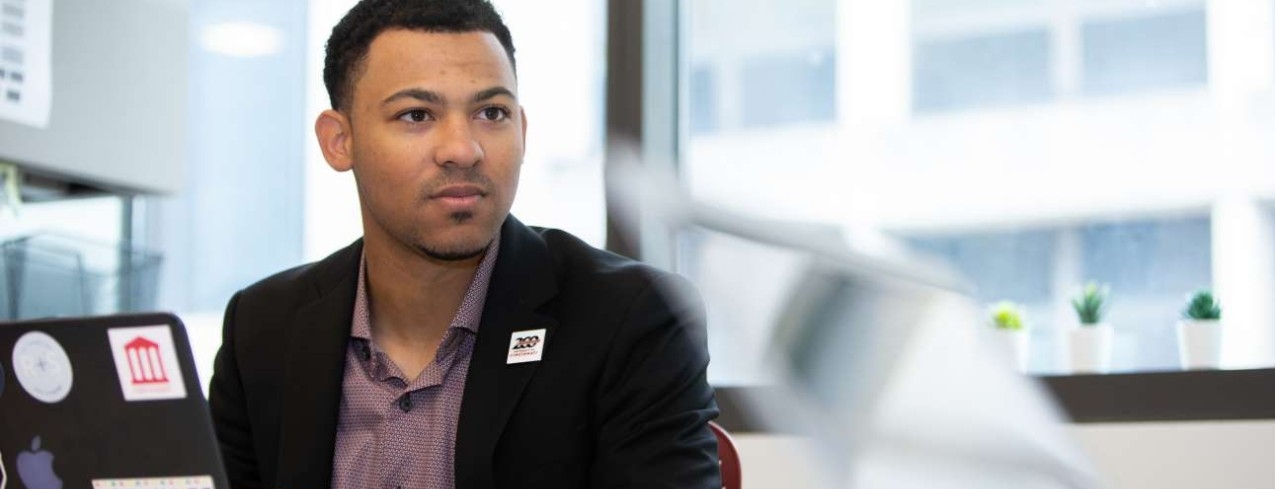 Chandler Rankin sits at desk