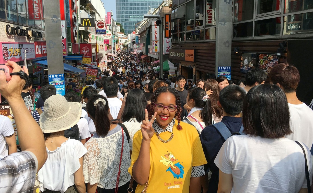 Kalea Lucas poses on a bustling street in Seoul, South Korea.