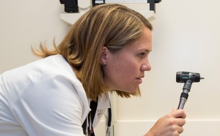 A doctor assesses a patient