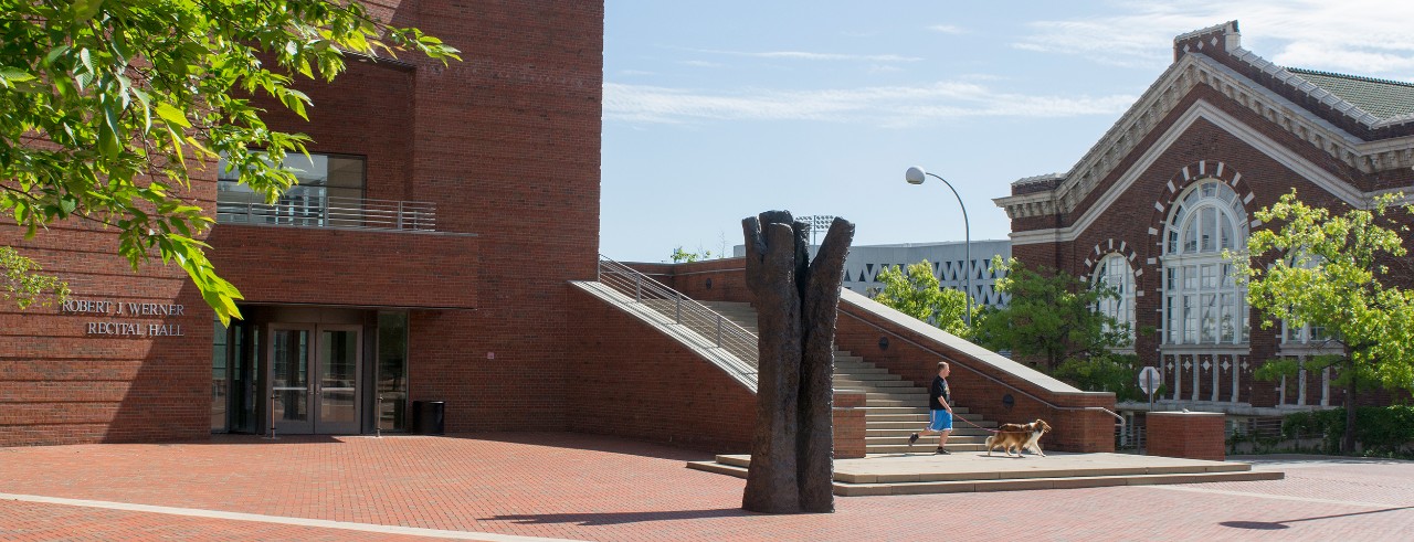 The main entrance to CCM's Corbett Center for the Performing Arts on a sunny day.