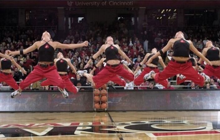 UC's dance team jumping in the air