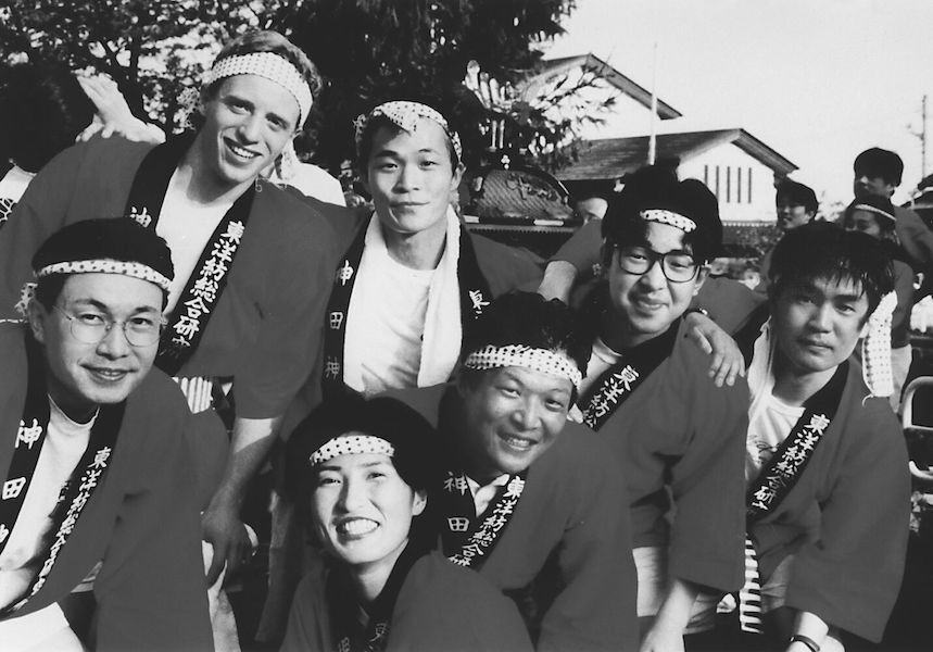 UC student poses with Japanese students while on co-op in the country.