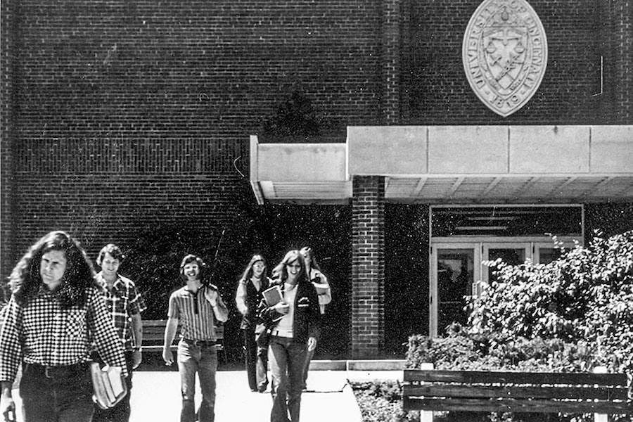 Black and white photo of students walking out of a building in late 1960s