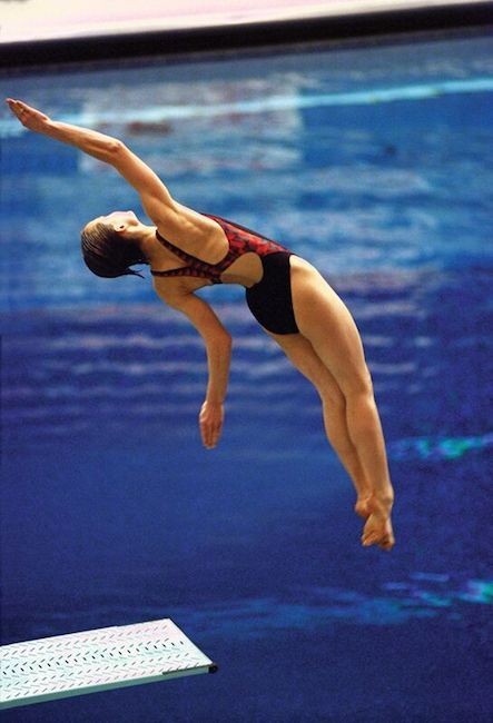 Woman diving into a pool