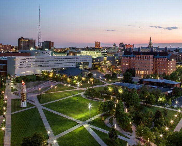 Beautiful shot of campus buildings and greenery at sunset