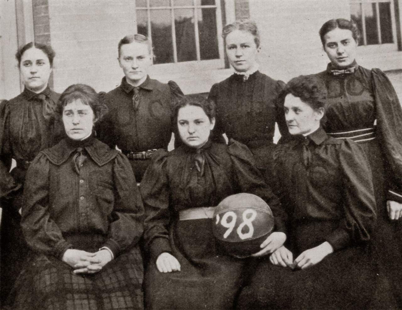 Black and white photo of 1898 women's basketball team