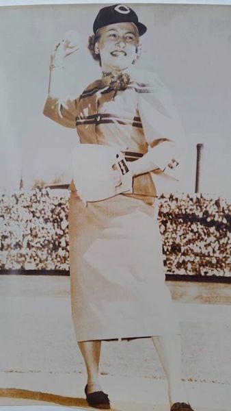 Black and white photo of  woman throwing Opening Day first pitch