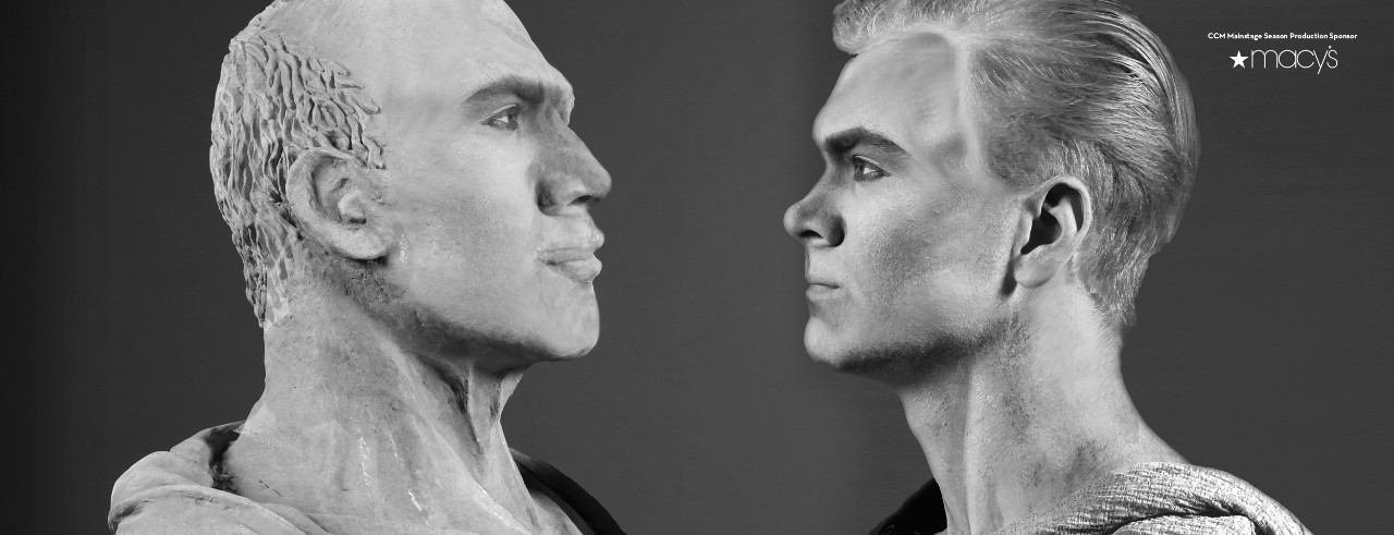 Two Roman emperor statues looking at each other.