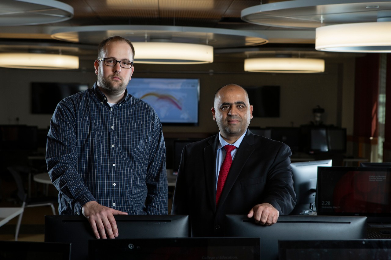 Hazem Said, Director of Information Technology Department at CECH, and Jason Gerst are working on the Ohio CyberRange.