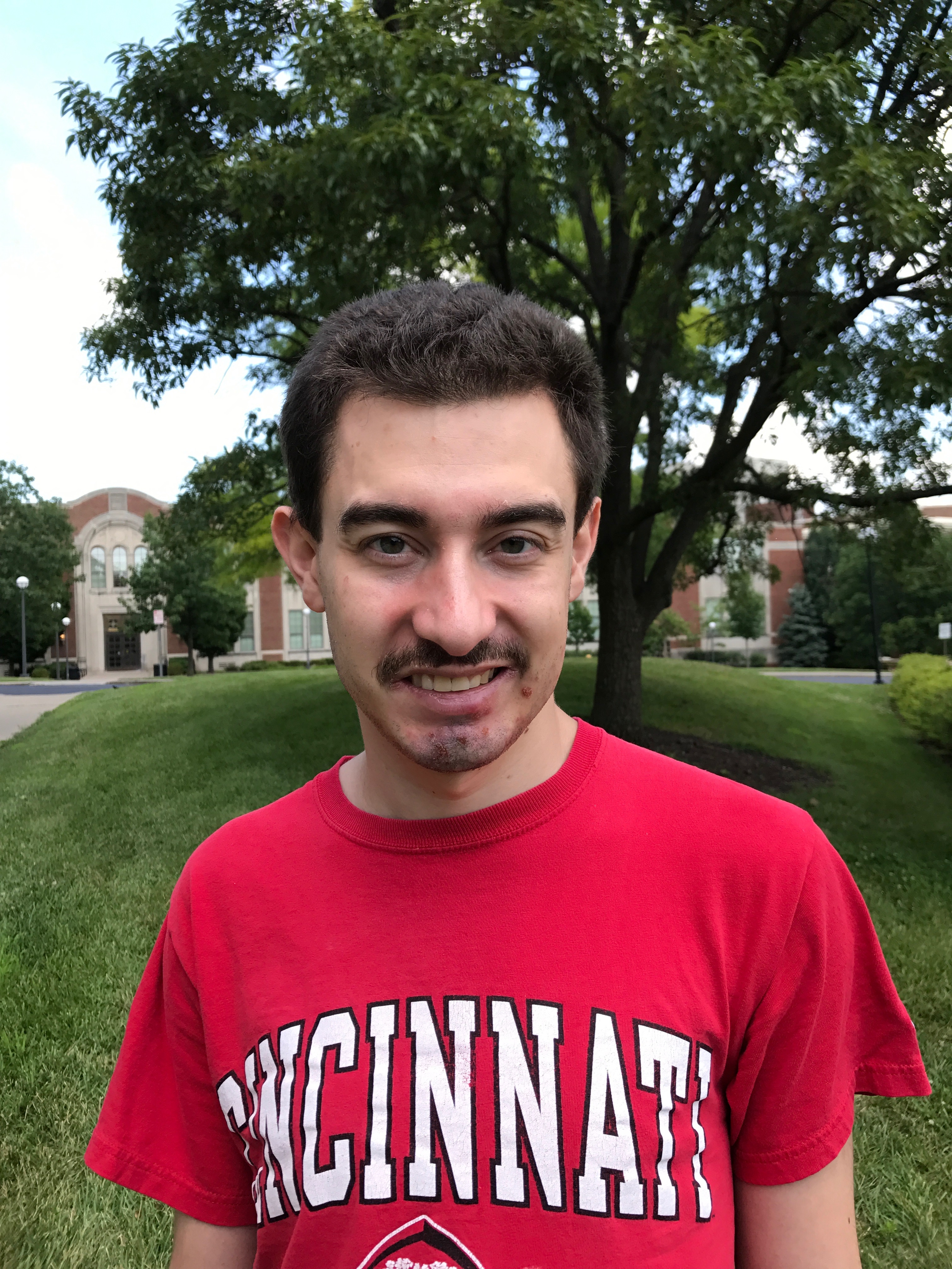 Vince Milano outside wearing a University of Cincinnati t-shirt.