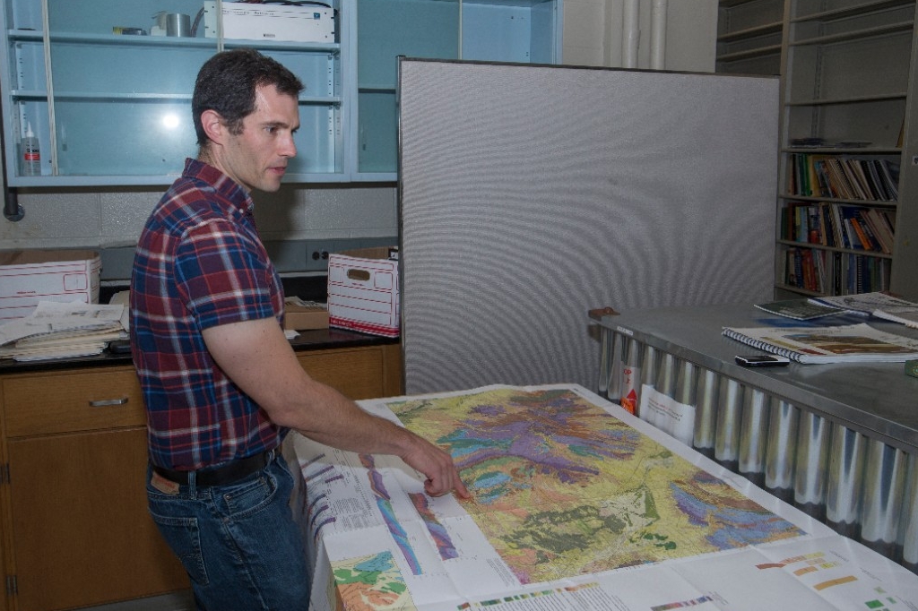 Daniel Sturmer, UC geology professor shown here in his at office and lab at Geo-Phys. UC/ Joseph Fuqua II