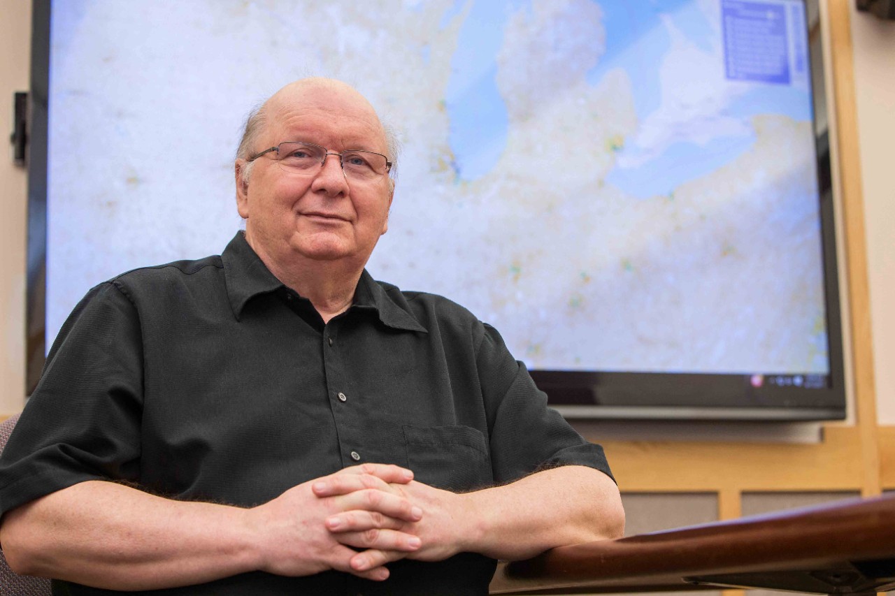 Tomasz F. Stepinski, Geography Professor, in front of a diversity map he developed.