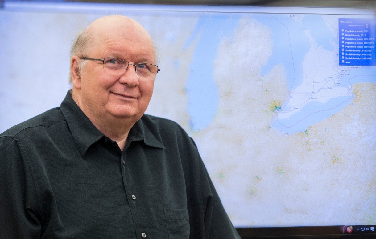 Tomasz F. Stepinski, Geography Professor, in front of a diversity map he developed.