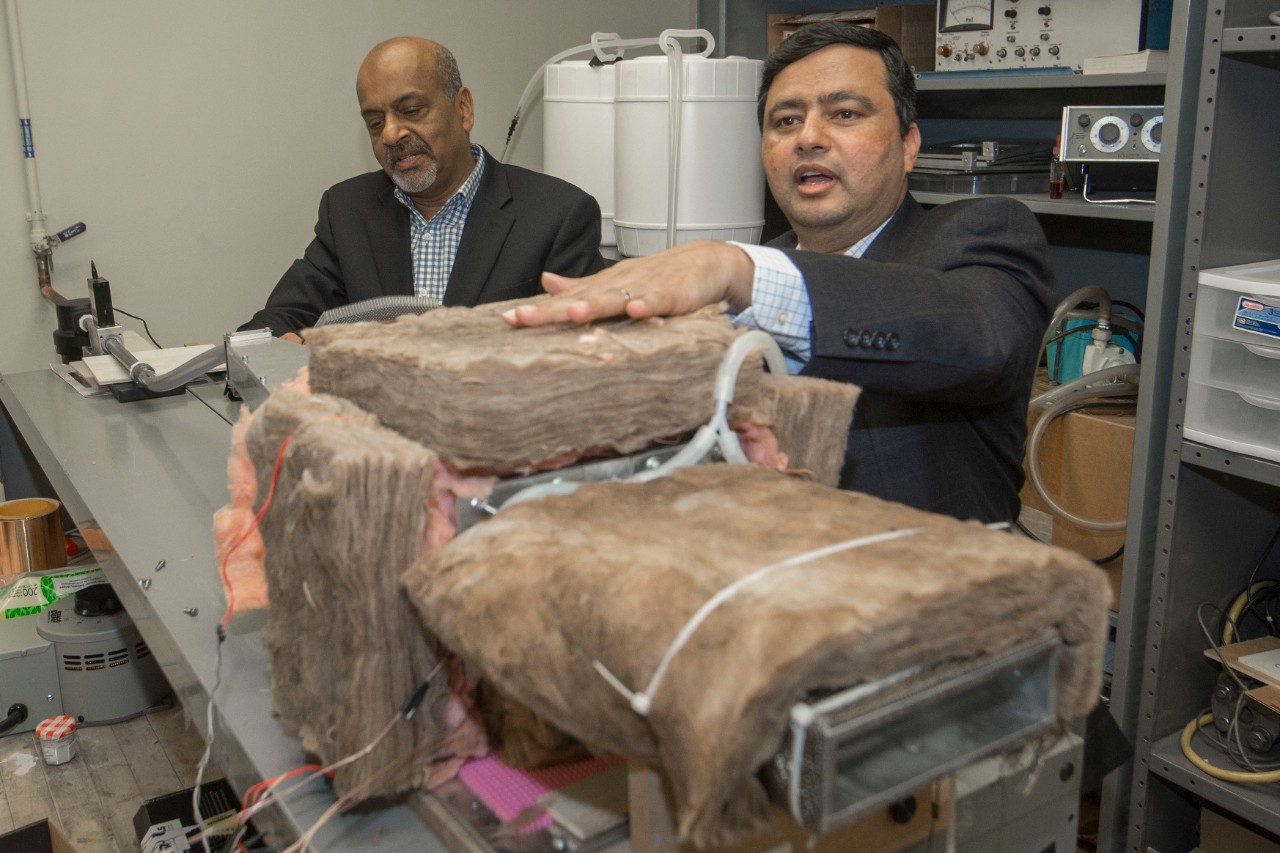 Dr. Raj Manglik, PhD, left and Dr. Milind Jog, PhD UC engineering research partners discussed their ongoing work in their Lab at Rhodes Halls. UC/Joseph Fuqua II 