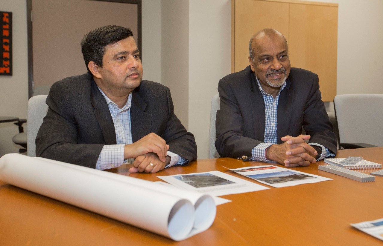 Dr. Milind Jog, PhD, left and Dr. Raj Manglik, PhD UC engineering research partners discussed their ongoing work at Rhodes Halls. UC/Joseph Fuqua II 