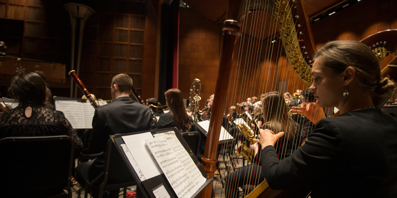 CCM wind students rehearse for an upcoming concert on stage at Corbett Auditorium.