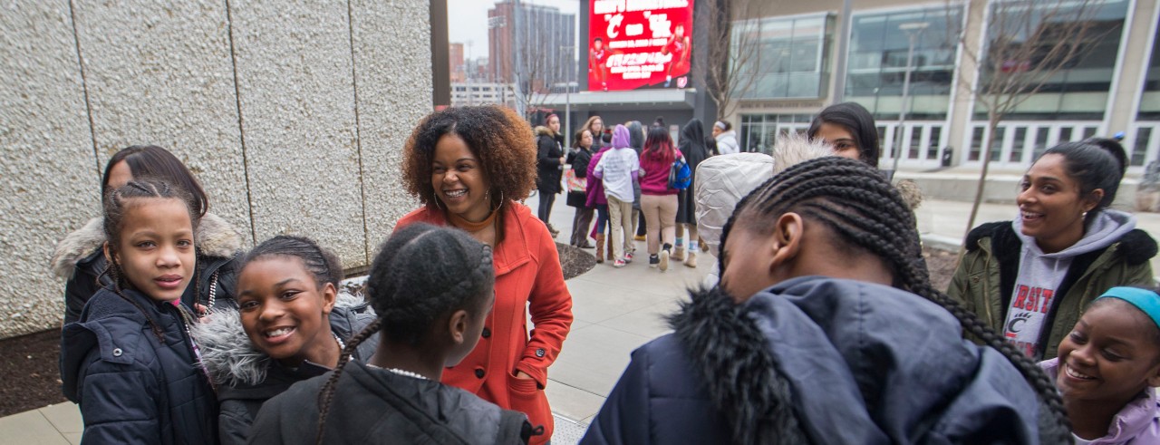 University of Cincinnati Tamie Sullivan, left looked on as Lauren White, University of Cincinnati student prepared to lead Girls with Pearls students on their tour of the University of Cincinnati campus outside of AACRC building. UC/Joseph Fuqua II
