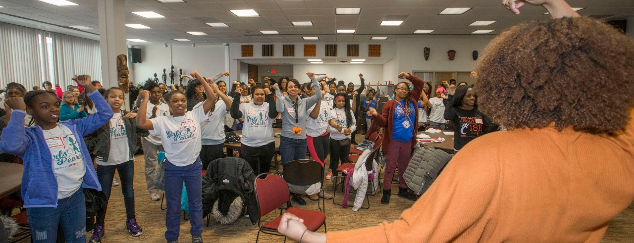 Lauren White, University of Cincinnati student spoke with students, Girls with Pearls from local CPS 4th-6th grade girls before starting their tour of the University of Cincinnati at AACRC building. UC/Joseph Fuqua II
