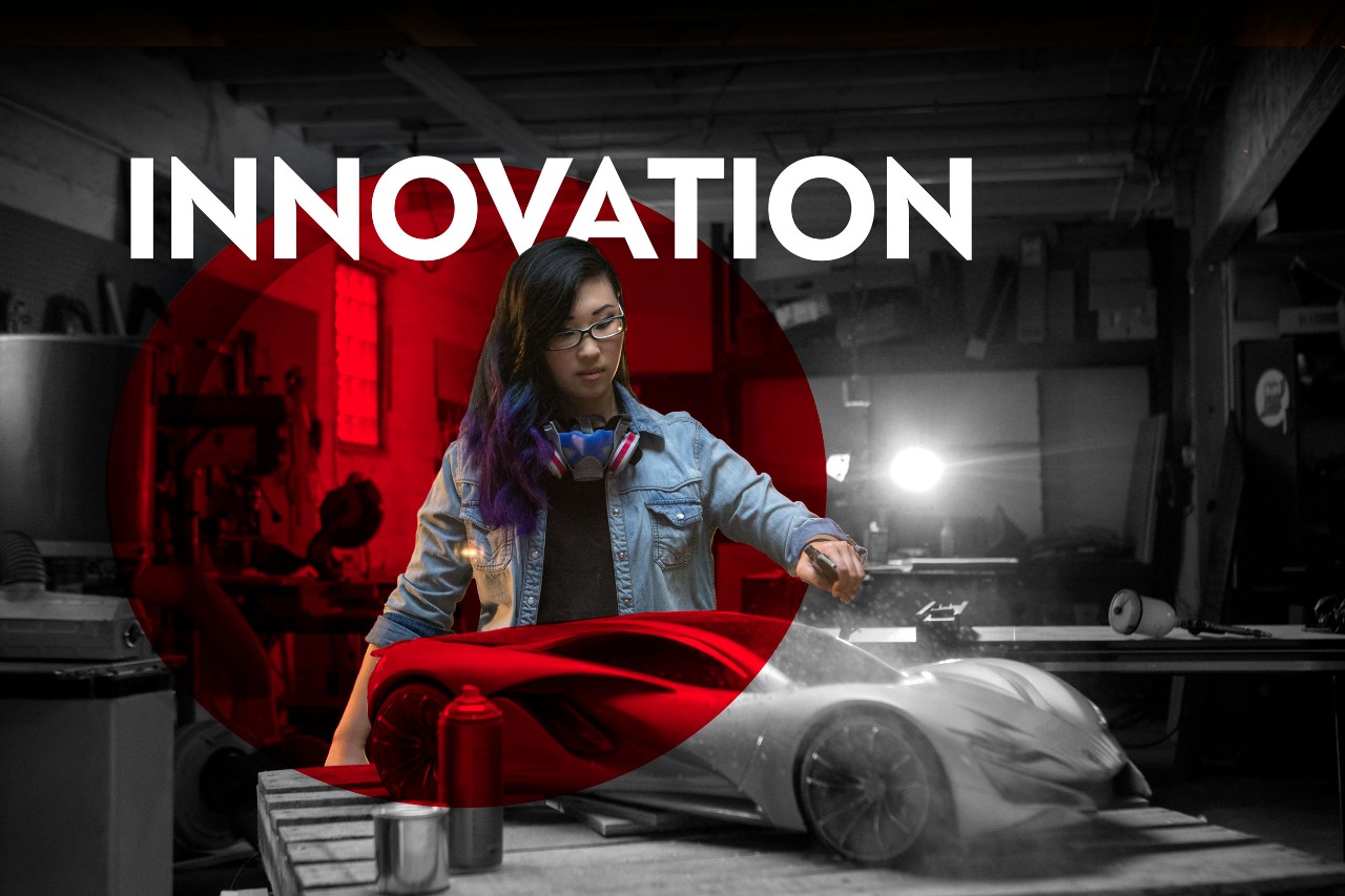 female working on car in lab