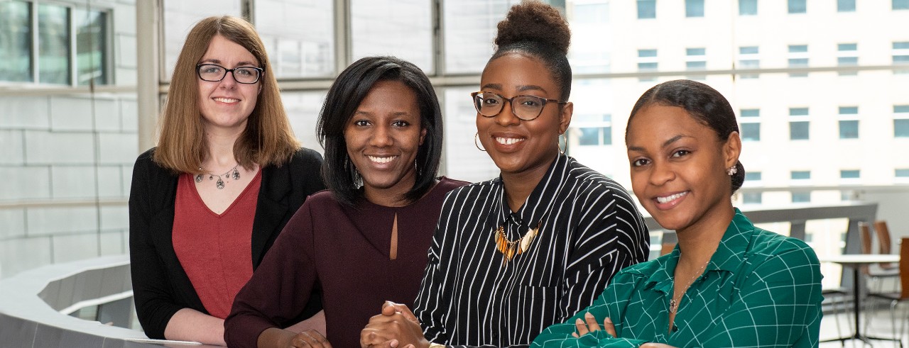 Four students are shown in the UC College of Medicine.