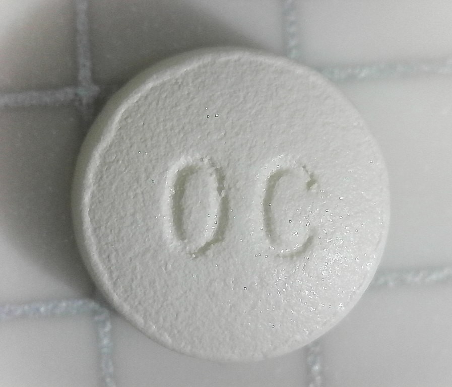 A closeup of an oxycontin tablet.