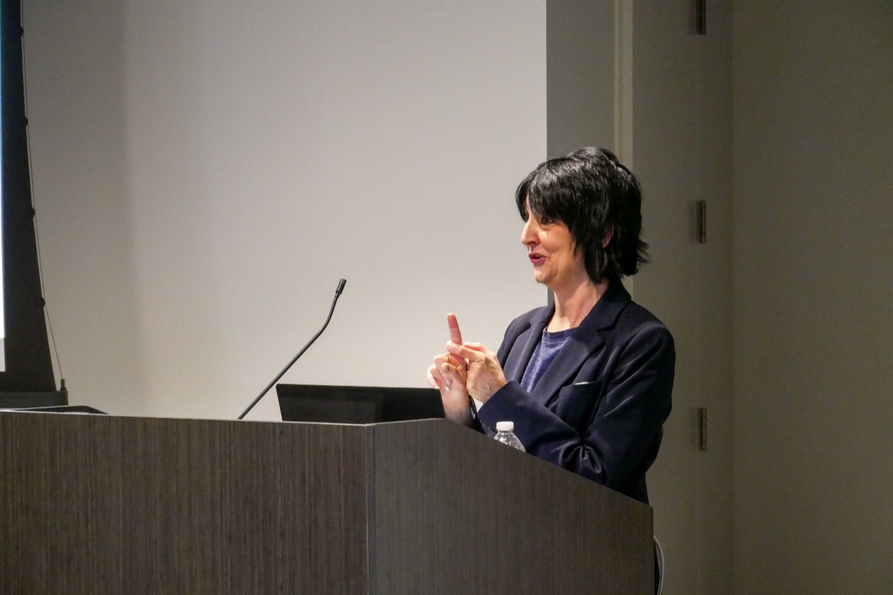 Terry DeMio talks at event