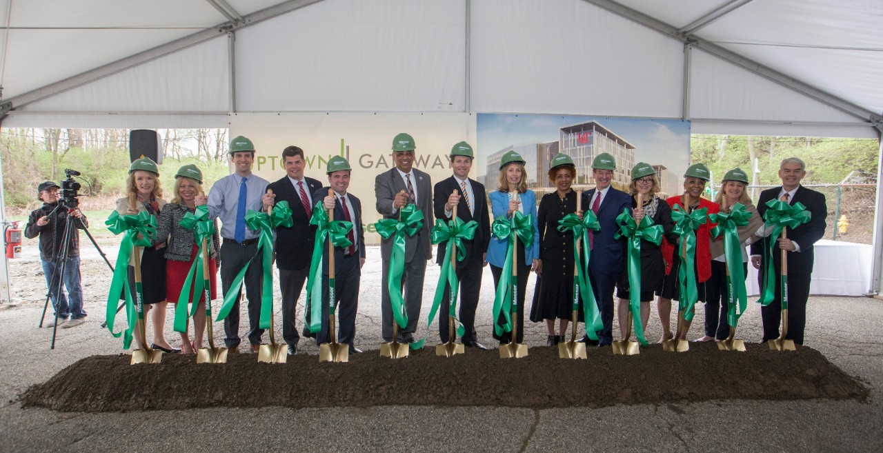 Officials with shovels at the groundbreaking event for the Uptown Gateway