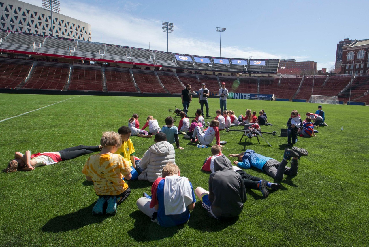 Local elementary school students are shown professor Cohen’s Drones at Nippert Stadium during Research Week & Innovation Week April 2, 2019. UC/Joseph Fuqua II 
