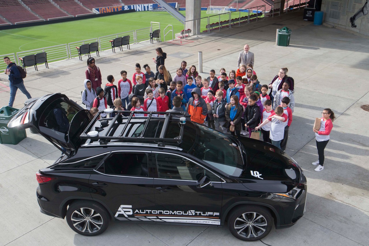 Elementary School students are shown UC Autonomous vehicle at Nippert Stadium for Research Week & Innovation Week April 2, 2019. UC/Joseph Fuqua II 

