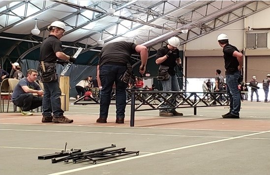 students work on steel bridge