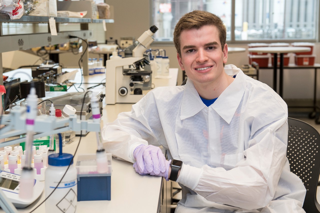 Andrew "Scottie" Emmert in CARE?Atrium and in lab.