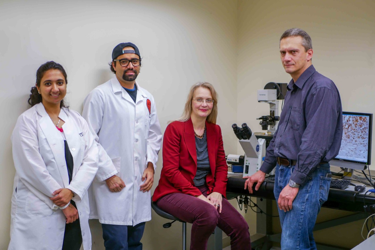 students and professors in lab
