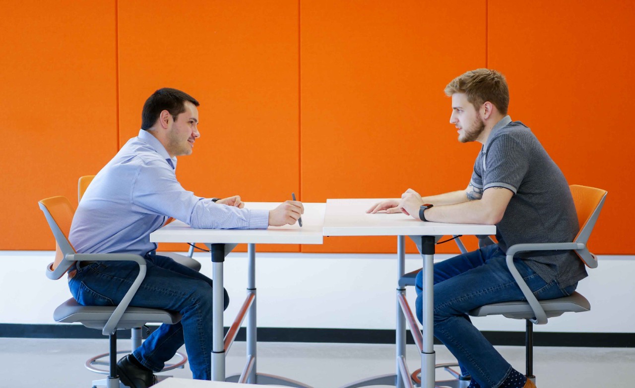 Brunton and Mace at desk