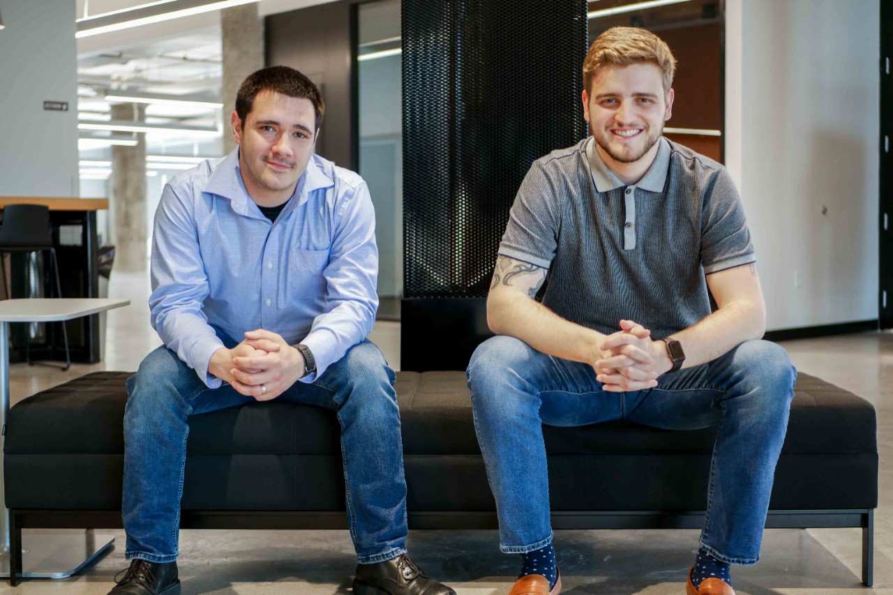 Mace and Brunton sit at bench