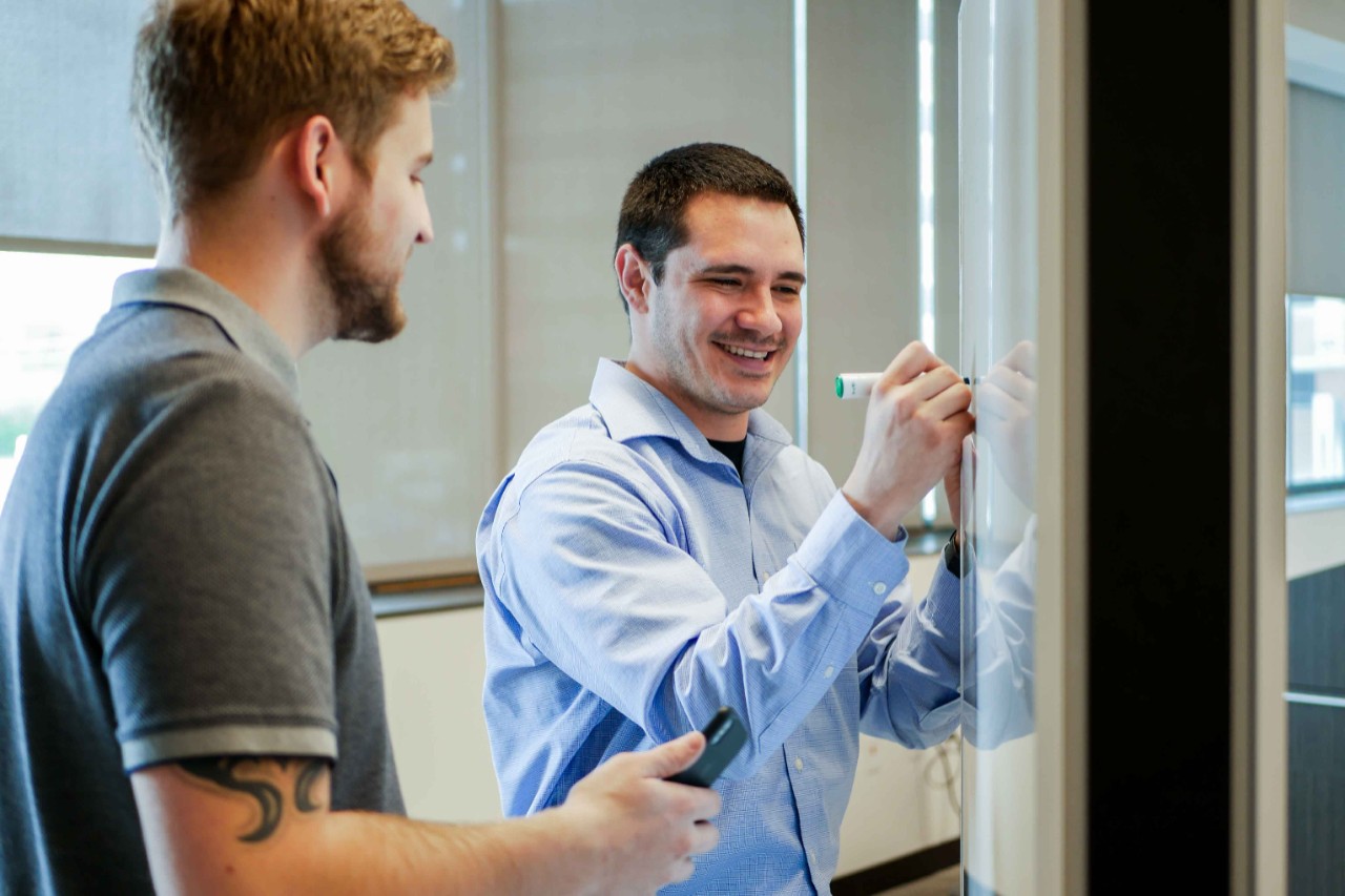 Mace and Brunton write on draw erase board