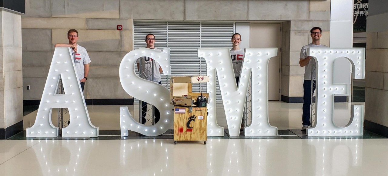 Students on stage with award